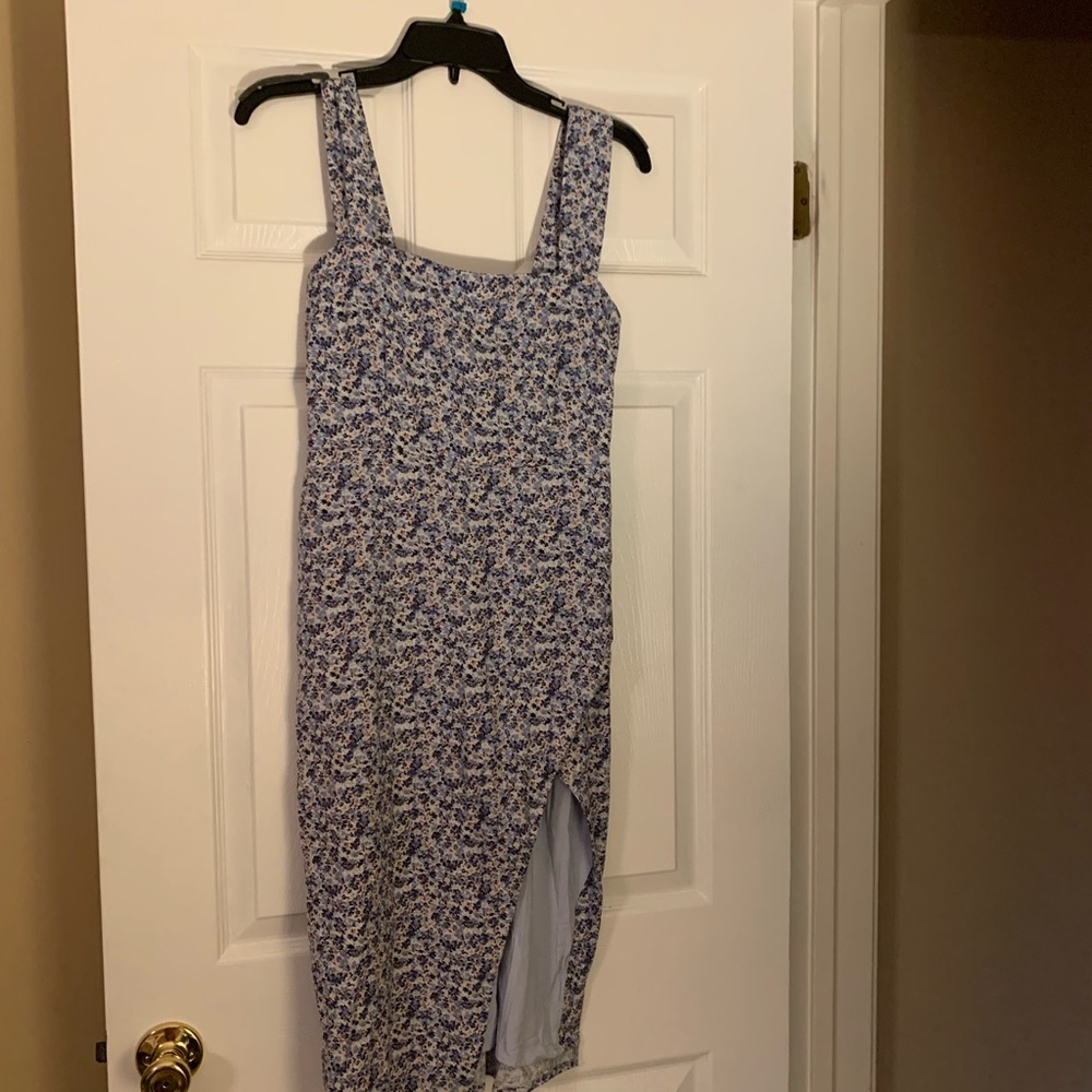 Brand new dress! Never worn. Has adjustable straps